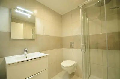 a bathroom with a toilet and a sink and a shower at Résidence Delattre in Cannes