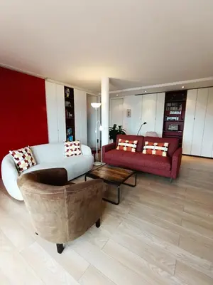 a living room with a couch and a table at Plages du Midi, Superbe Vue Mer, Grand Confort, 4 pers in Cannes
