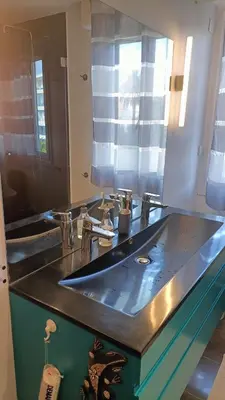 a bathroom with two sinks and a large mirror at Plages du Midi, Superbe Vue Mer, Grand Confort, 4 pers in Cannes