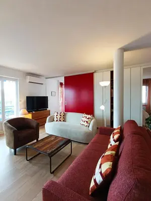 a living room with a couch and a table at Plages du Midi, Superbe Vue Mer, Grand Confort, 4 pers in Cannes
