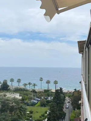 a view of the ocean from the balcony of a building at Appartement rooftop, première ligne, vue mer, 50m de plage du Midi in Cannes