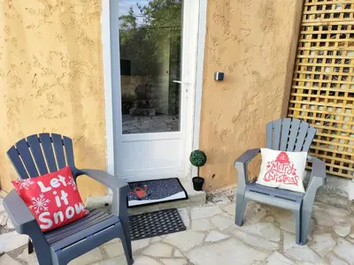 two chairs sitting in front of a door at Idéal pied à terre proche Cannes & Sophia, parking in Mougins