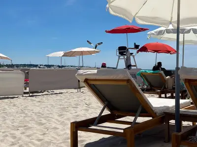 a group of chairs and umbrellas on a beach at Cannes Centre, 3 Chambres, Plage et La Croisette à 50m in Cannes