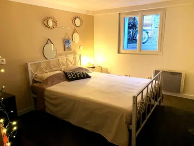a bedroom with a large white bed with a window at Cannes Charming Villa Private Pool near beaches new award 10 out of 10 in Le Cannet