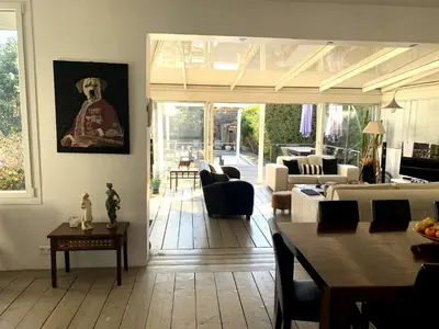 a living room with a couch and a table at Cannes Charming Villa Private Pool near beaches new award 10 out of 10 in Le Cannet