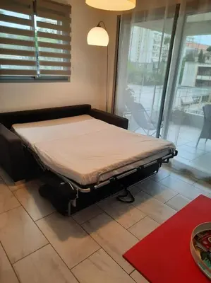 a hospital bed in a room with a window at Studio Croix des Gardes Palais Plages in Cannes