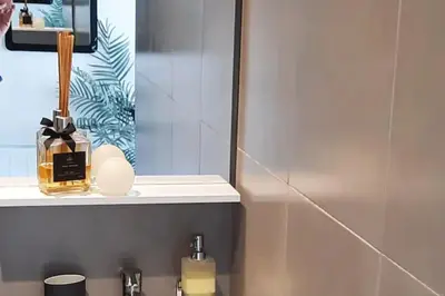 a bathroom with a mirror and a bottle on a sink at Studio Croix des Gardes Palais Plages in Cannes