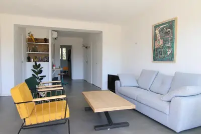 a living room with a couch and a table at Sunset Loft in Cannes