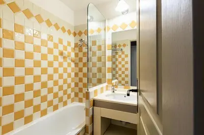 a bathroom with a tub and a sink and a bath tub at Résidence Cannes Villa Francia - maeva Home - Appartement 2 Pièces 4 Personnes - Confort MAE-4184 in Cannes
