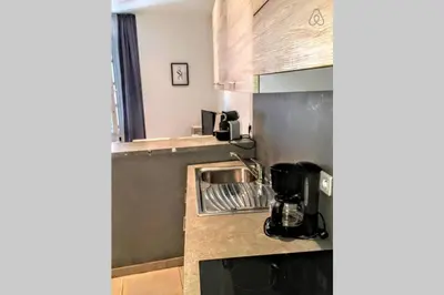 a kitchen with a sink and a counter top at C038-Elegant apt a few steps from beaches - Le Suquet in Cannes