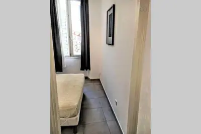 a living room with a couch and a window at C038-Elegant apt a few steps from beaches - Le Suquet in Cannes