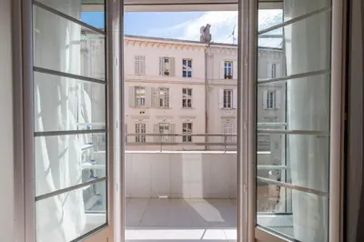 an open window with a view of a building at 3-Br apartment in the Golden Square in Cannes