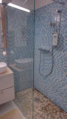 a bathroom with a shower with a glass door at Les Tambourins Studio 19 - 3 étoiles in Cannes