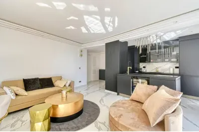 a living room with a couch and a table at Somptueux logement,Cannes Croisette,4 Étoiles**** in Cannes