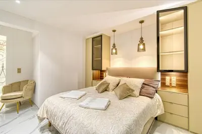 a bedroom with a bed with two towels on it at Somptueux logement,Cannes Croisette,4 Étoiles**** in Cannes