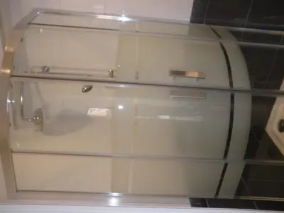 a glass cabinet with a drawer in a room at NICE FLAT WITH GARDENS Limites cannes juste 10 MNS CROISETT in Le Cannet