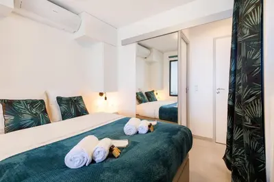 a bedroom with a bed with white towels on it at Fettolina in Cannes