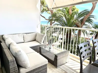 a living room with a couch and chairs on a balcony at Fettolina in Cannes