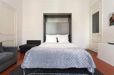a bedroom with a bed and a couch at 1 bedroom appartement Cannes (Carnot) in Cannes