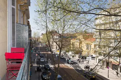 a view of a city street from a balcony at 1 bedroom appartement Cannes (Carnot) in Cannes