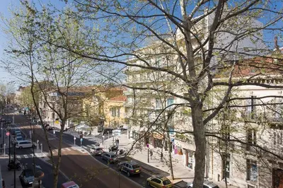 a city street with cars parked on the street at 1 bedroom appartement Cannes (Carnot) in Cannes