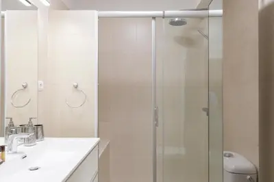 a bathroom with a shower and a sink at Phoenix YourHostHelper in Cannes