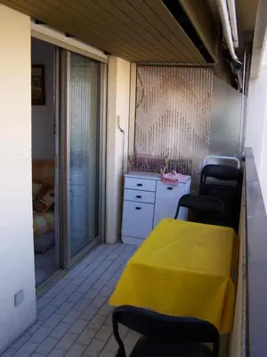 a dining room with a yellow table and chairs at Comfortable Flat With Balcony Cannes City Centre in Cannes