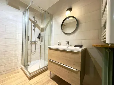 a bathroom with a sink and a shower at L'Alexandra By SCLS Locations in Cannes