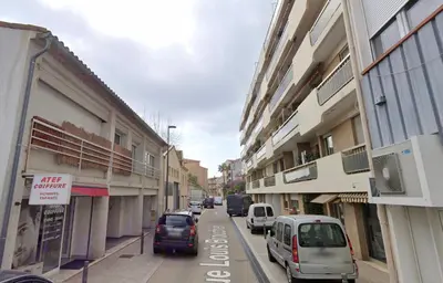 a city street with cars parked on the street at L'Alexandra By SCLS Locations in Cannes
