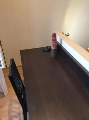 a wooden table with ainylinylinylinyl at Lecerf apartment in Cannes
