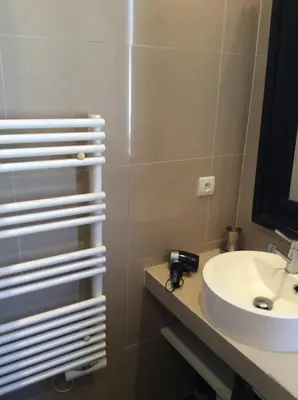 a bathroom with a sink and a mirror at Lecerf apartment in Cannes