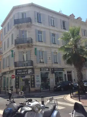 a group of motorcycles parked in front of a building at Lecerf apartment in Cannes