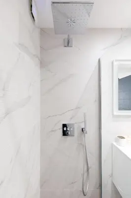 a bathroom with a shower with white marble walls at Cannes CROISETTE, Palais des Festivals, Beaches, Apart Residence Le MINERVE in Cannes