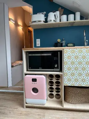 a microwave oven sitting inside of a kitchen at Au petit Marius in Cannes