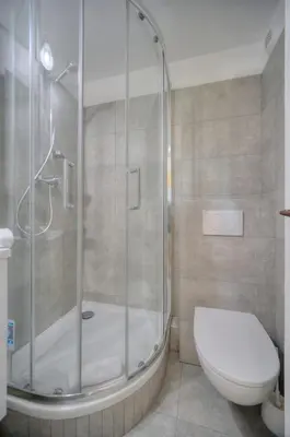 a bathroom with a shower and a toilet at IMMOGROOM - sea view - Pool - Terrace - Parking - Wifi - AC in Cannes