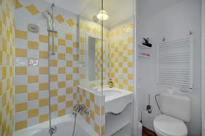 a bathroom with a sink and a toilet and a shower at IMMOGROOM - 2 Rooms sea view - Swimming pool - Terrace - Parking - AC in Cannes