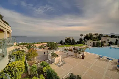an aerial view of a resort with a swimming pool at IMMOGROOM - 2 Rooms sea view - Swimming pool - Terrace - Parking - AC in Cannes
