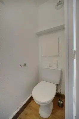 a bathroom with a white toilet in a room at IMMOGROOM - 2 Rooms - Renovated - Pool - Parking - Air conditioning - in Cannes