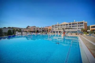 a large swimming pool in front of a hotel at IMMOGROOM - 2 Rooms - Renovated - Pool - Air conditioning - Parking - Wifi in Cannes