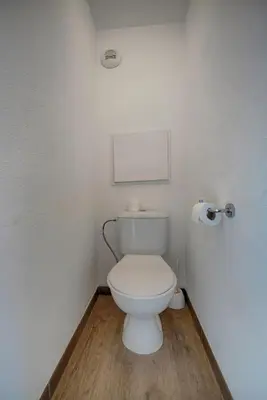 a bathroom with a white toilet in a room at IMMOGROOM - 2 Rooms sea view - Swimming pool - Terrace - Parking - AC in Cannes