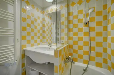 a bathroom with a sink and a shower and a tub at IMMOGROOM - 2 Rooms sea view - Renovated - Pool - Terrace - Parking - AC in Cannes