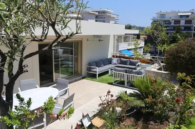 a view of a patio with furniture and plants at ROOFTOP CROISETTE/ALEXANDRE III in Cannes
