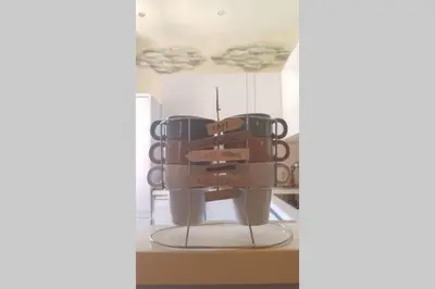a group of coffee cups sitting on a shelf at C069-Magnifique appartement au coeur du suquet in Cannes