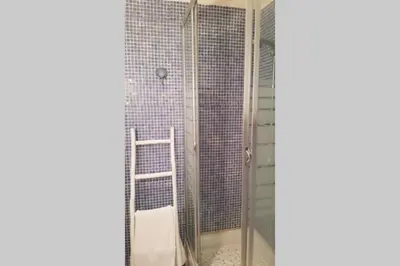 a shower with a glass door in a bathroom at C069-Magnifique appartement au coeur du suquet in Cannes