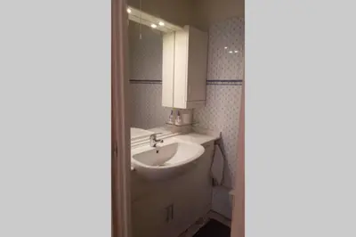 a bathroom with a sink and a mirror at C069-Magnifique appartement au coeur du suquet in Cannes