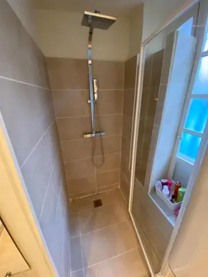 a shower with a glass door in a bathroom at C054-Bel Appartement Lumineux au Coeur du Suquet in Cannes