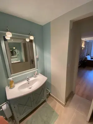 a bathroom with a sink and a mirror at C054-Bel Appartement Lumineux au Coeur du Suquet in Cannes
