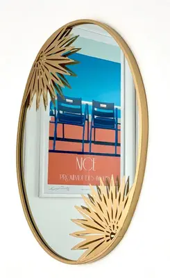 a round mirror with a picture of chairs in front of it at Superbes studios entièrement rénovés - 50m croisette in Cannes