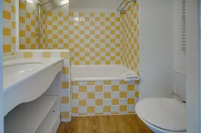 a bathroom with a toilet and a tub and a sink at IMMOGROOM - 3 Rooms - Renovated - Pool - Air conditioning - Parking - Wifi in Cannes