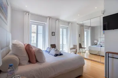 a white room with a bed and a bedroom at Villa Terra by Festif Azur - House 250m2 Quiet, 5 min walk from Palais des Festivals and Beaches in Cannes